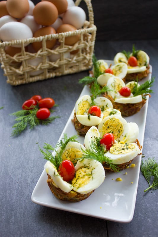 Easter Egg Tart Potato Nests. This fancy looking perfect Easter egg appetizer lis Quick and Easy, and makes a perfect brunch table! Gluten free and only 80 calories! Recipe with step by step photos to prepare this in a snap! www.twopurplefigs.com