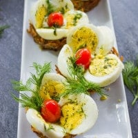 Easter Egg Tart Potato Nests on a white rectangular plate