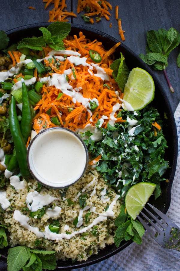 close up of the carrot mint salad and kale drizzled with tahini sauce