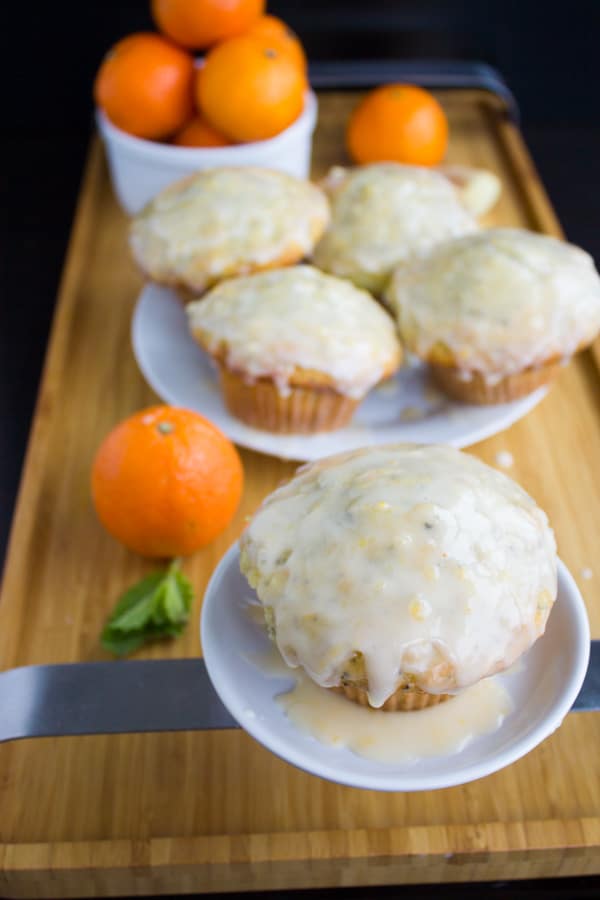 Glazed Lemon Poppy Seed Muffins with Clementine and Ginger on two white plates