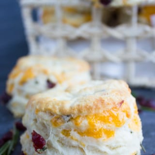 How To Make Biscuits With Cheddar Rosemary & Cranberries. Seriously the secret is OUT--the ultimate tips, step by step and secret to make FLUFFY, PILLOWY homemade biscuits! Get this base recipe now and enjoy it forever! www.twopurplefigs.com
