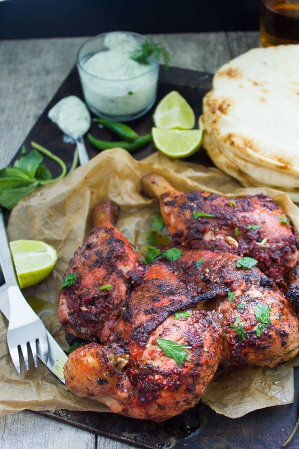 Butterflied Quick Roast Tandoori Chicken sprinkled with fresh cilantro leaves