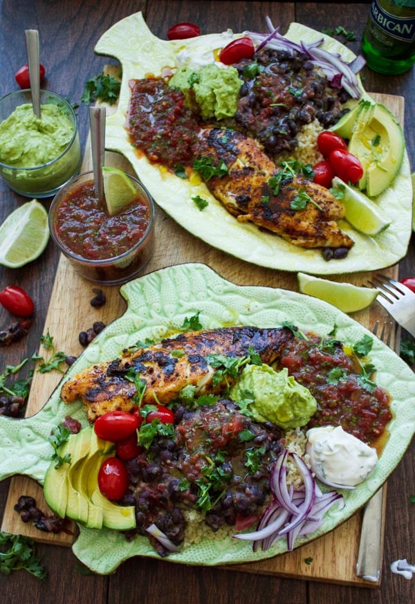 pan-fried tilapia fish fillets crusted with Mexican spices and served with black beans, guacamole and salsa