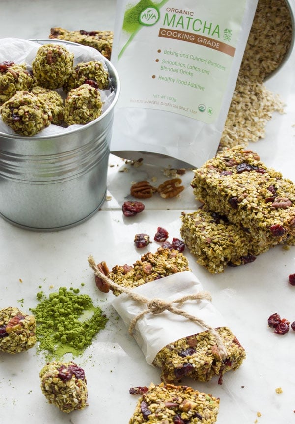 Banana Matcha Energy Bites and granola bars with some green tea powder in the background