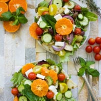 Orange Lentil Greek Salad. The perfect way to jazz up your Greek salad--make it hearty, filling, nutritious and absolutely YUMMY! Dressed up in an orange olive homemade Greek salad dressing, it's a perfect full meal salad, bbq salad, potluck, picnic, lunch, anything salad! Vegan and gluten free too--make this recipe today!