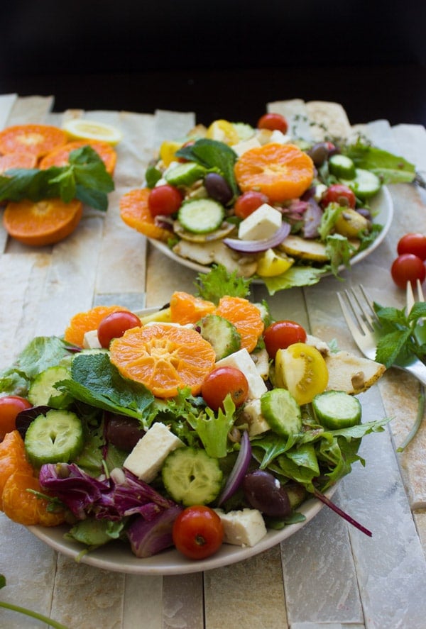 Orange Lentil Greek Salad. The perfect way to jazz up your Greek salad--make it hearty, filling, nutritious and absolutely YUMMY! Dressed up in an orange olive homemade Greek salad dressing, it's a perfect full meal salad, bbq salad, potluck, picnic, lunch, anything salad! Vegan and gluten free too--make this recipe today!