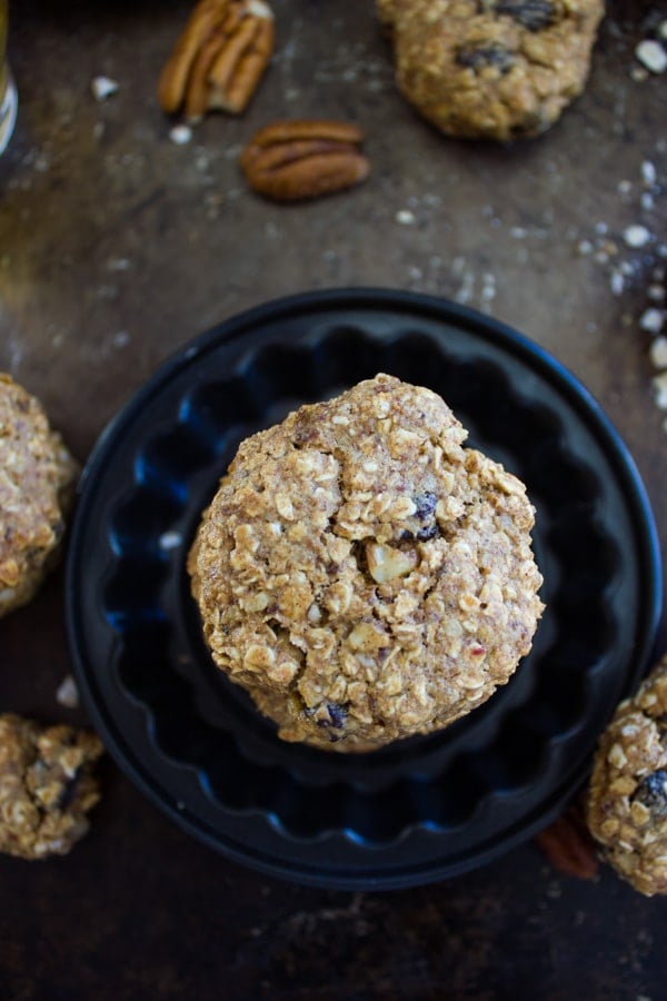 overhead shot of a stack of Vegan Oatmeal Raisin Cookies on a small black plate