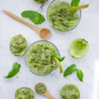Cool Mint Chia Kiwi Slush. Get the tips and recipe for making the ultimate fruit SLUSH--no sugars, syrups or sweeteners added--just REAL fruit! Spiked with Mint and Chia seeds this is the best way to cool down for the summer! www.twopurplefigs.com