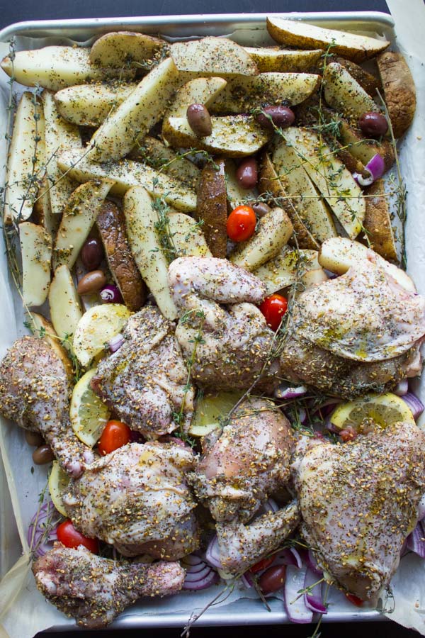 all ingredients for One Pan Chicken Potato Bake on a tray ready to go in the oven