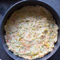 cornbread batter in the pan ready to go in the oven