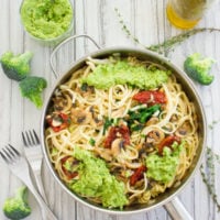 overhead shot of a skillet with healthy broccoli pesto pasta