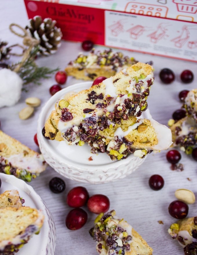 Cranberry Pistachio Biscotti recipe dipped in white chocolate and sprinkled with cranberries and pistachios