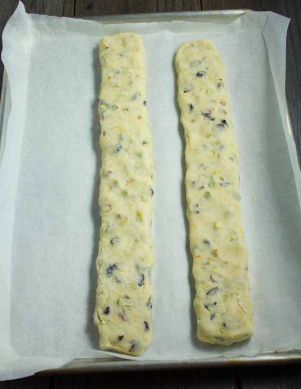 biscotti dough baking in two logs before cutting