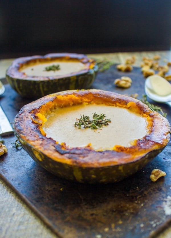 side view of vegan Walnut Squash Soup served in roasted Kabocha Squash Cups