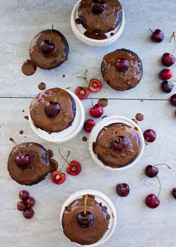 Mini Black Forest Cupcakes topped with chocolate glaze and fresh cherries 