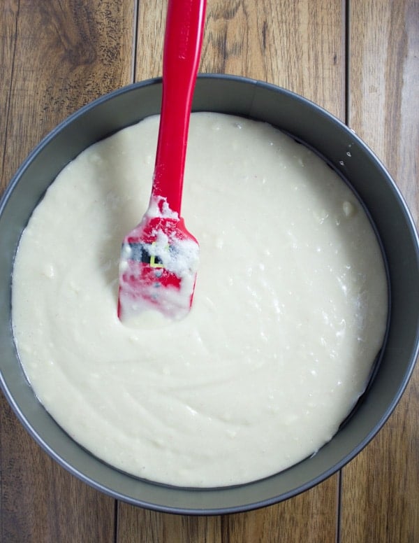 vanilla cake batter poured into a springform pan