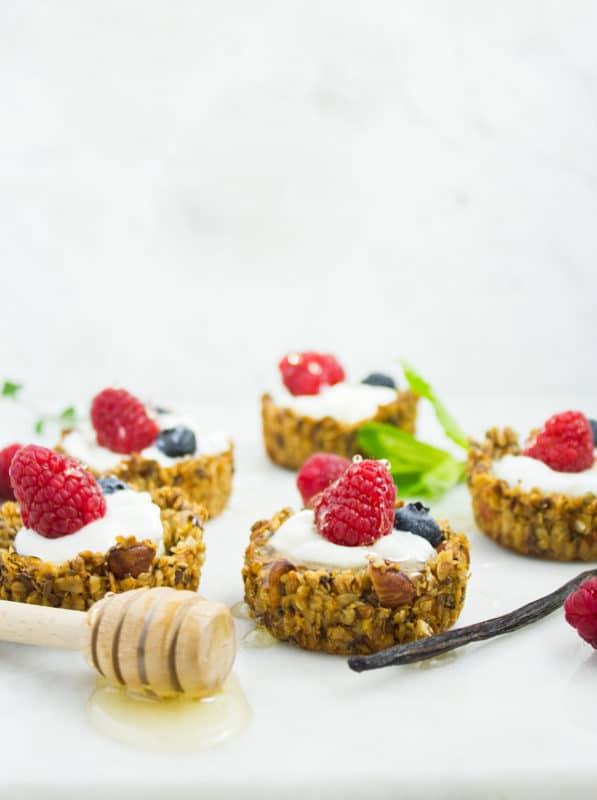 Healthy Breakfast Granola Yogurt Cups. The perfect combo of crunchy almond chia honey granola with velvety smooth Greek yogurt in bits size goodness! Easy, versatile and the perfect way to start your day! Get the recipe with tips and tricks to make this today! www.twopurplefigs.com