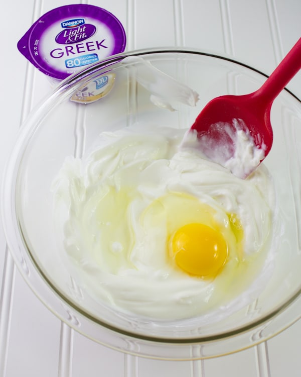 egg and Greek yogurt in a glass bowl 