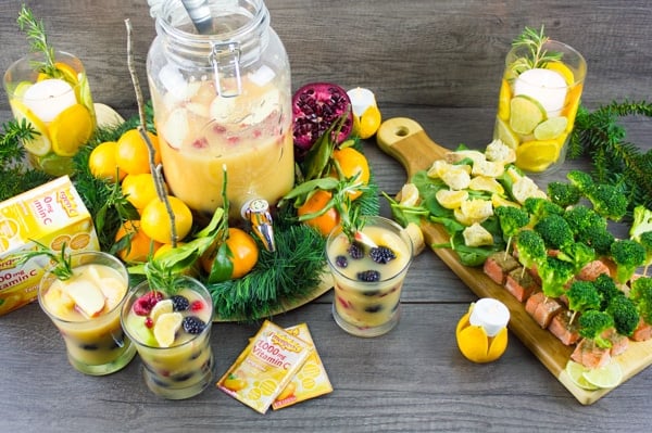 Fruity Non Alcoholic Sangria and Orange Salmon Bites festively arranged on a rustic table top