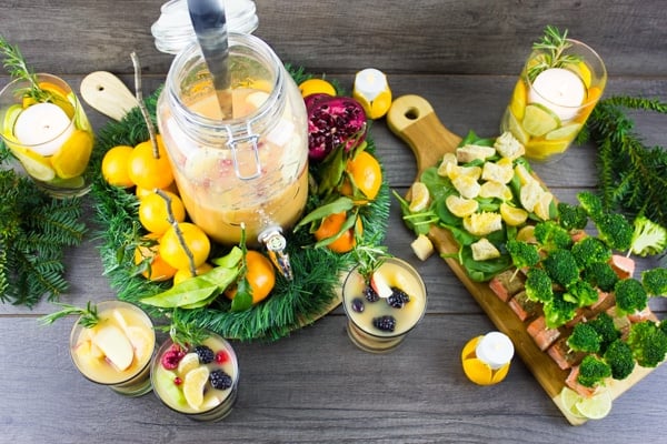 Fruity Non Alcoholic Sangria and Orange Salmon Bites festively arranged on a rustic table top