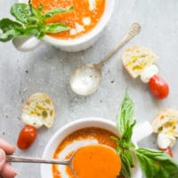 Luscious Carrot Tomato Basil Soup. This soups doesn't taste like marinara or carrots--it tastes like a sweet delicate tomato and basil soup that's seriously delicious and luscious! It all happens in a sheet pan in the oven and no fuss or cooking needed! Easy yummy comfort food! www.twopurplefigs.com