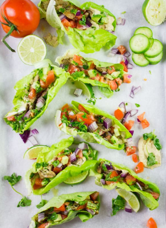 Chicken Shawarma in Lettuce Cups. Get the ultimate way to go healthy with a flavor packed succulent chicken shawarma served in lettuce cups. Hummus and all your favorite toppings included--a step by step recipe you need to make! www.twopurplefigs.com