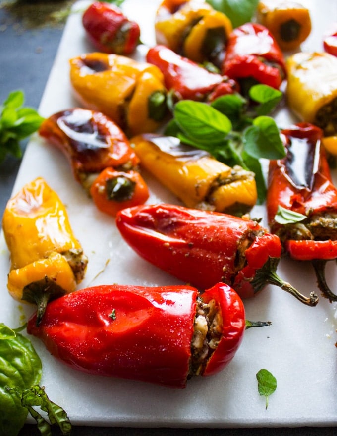 Close up of a stuffed bell pepper on a white marble 