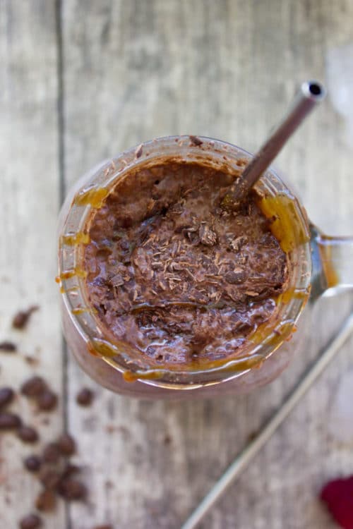 overhead shot of Espresso Brownie Chocolate Smoothie served in a mason jar glass with a straw