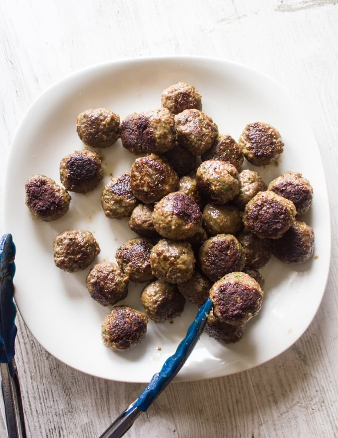 Sauteed and crispy Turkish meatballs removed from the pan and ready for the tomato sauce