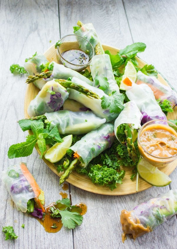  Rice Paper Rolls arranged on a plate with Two Dipping Sauces on the side