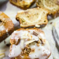 overhead shot of banana bread muffins with cream cheese swirl and icing