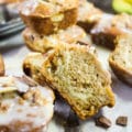 One Banana Bread Muffin cut in half showing the cream cheese swirl in the middle and how fluffy the texture is