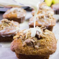 Banana Bread Muffins being glazed with cream cheese icing right before serving