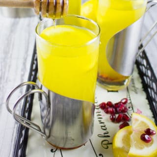 Soothing Lemon Ginger Turmeric Drink. The ultimate soothing and boosting drink to get you going! It's like a lemon ginger tea with the benefits of turmeric! get the recipe at www.twopurplefigs.com