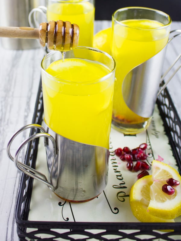 Soothing Lemon Ginger Turmeric Drink. The ultimate soothing and boosting drink to get you going! It's like a lemon ginger tea with the benefits of turmeric! get the recipe at www.twopurplefigs.com