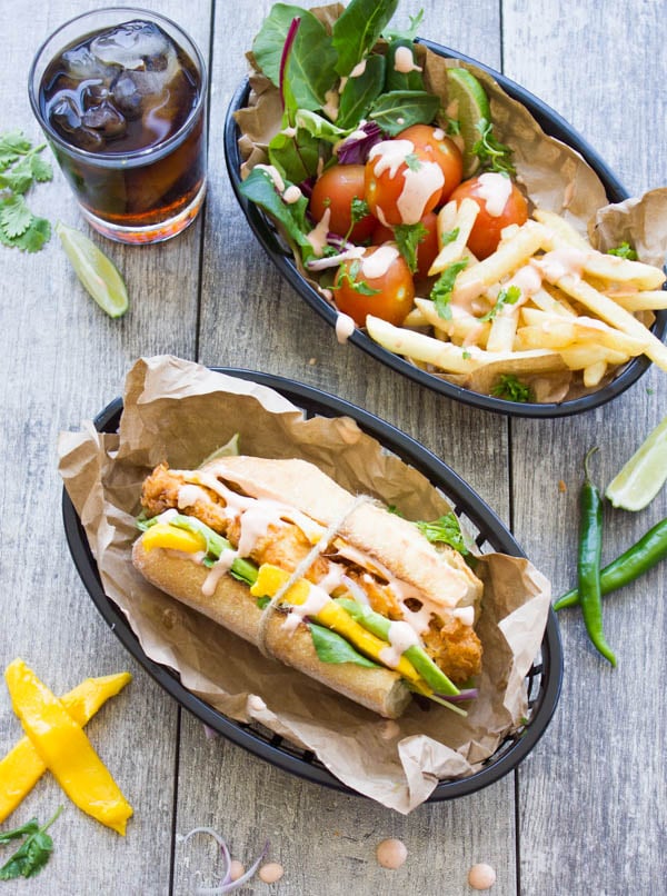 Spicy Sweet Sriracha Mango Chicken Sandwich served with a side of fries and a drink