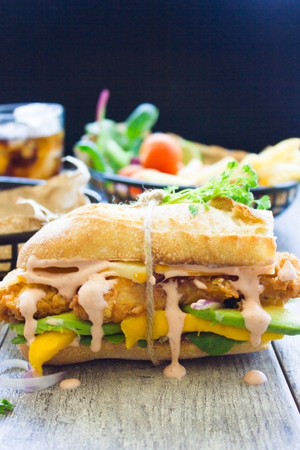 side view of Spicy Sweet Sriracha Mango Chicken Sandwich.