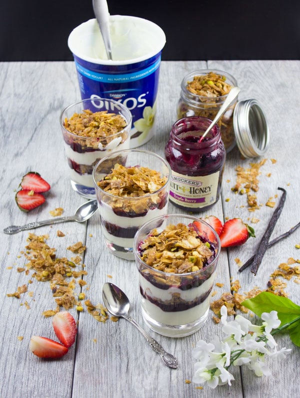 Baklava Yogurt Parfait with Homemade Baklava Crumbles served in glasses with fresh strawberries and some baklava crunch surrounding them