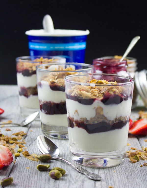 Baklava Yogurt Parfait with Homemade Baklava Crumbles served in glasses with fresh strawberries and some baklava crunch surrounding them