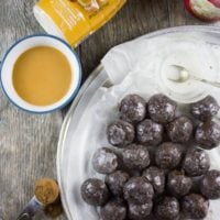 Caramel Spiked Chocolate Donut Holes. The best baked donut holes you'll ever make! tender, fluffy and intensely chocolate-y with a spike of caramel in the donut and glaze! Get the step by step recipe-www.twopurplefigs.com