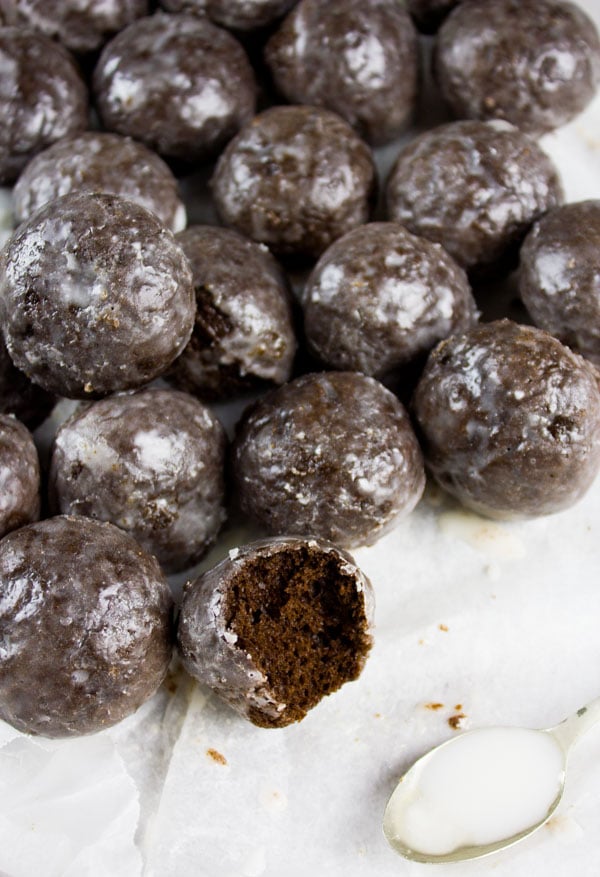 Caramel Spiked Chocolate Donut Holes. The best baked donut holes you'll ever make! tender, fluffy and intensely chocolate-y with a spike of caramel in the donut and glaze! Get the step by step recipe-www.twopurplefigs.com