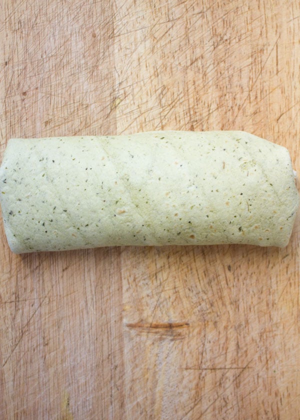 a wheat tortilla filled with Roasted chickpeas rolled into a wrap