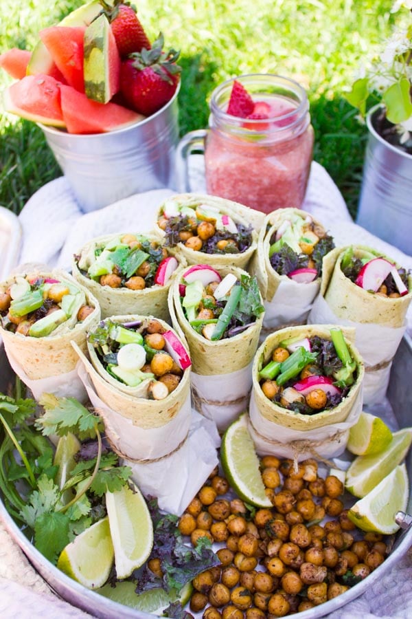 Roasted Chickpeas Wraps on a silver tray served al fresco with summery cocktails and more roasted chickpeas on the side