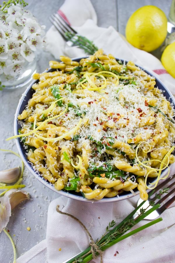 overhead shot of a bowl of easy Garlic Lemon Pasta topped with grated parmesan