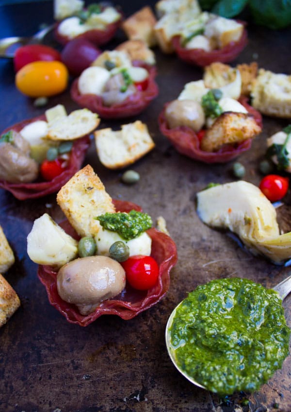 assorted antipasto In Bite Size Salami Cups with some pesto on the side
