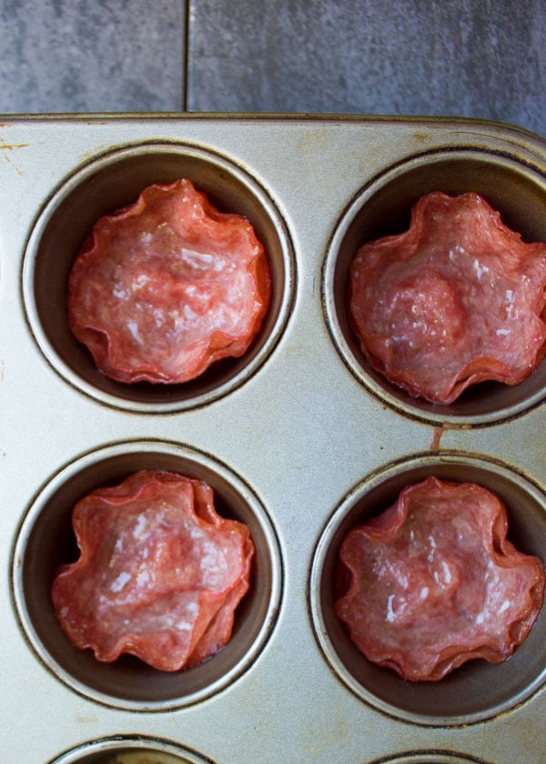 homemade salami cups fresh out of the oven in a muffin pan