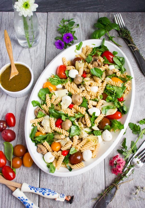 overhead shot of a Warm Antipasto Platter of chickpea Pasta with bocconcini and tomatoes