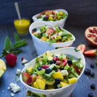 Fruity Greek Salad With Sweet Mango Salad Dressing. This is absolutely my FAVORITE salad recipe! Fresh sweet summer fruits with tangy feta in a sweet Mango Greek Salad Dressing! Summer heaven! www.twopurplefigs.com