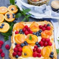 Peach Orange Mango and Ricotta Tart with Phyllo Dough. Baking has never been so easy, divine, creamy and fruity! Perfect for entertaining, this tart is an all time favorite and very forgiving! recipe: www.twopurplefigs.com