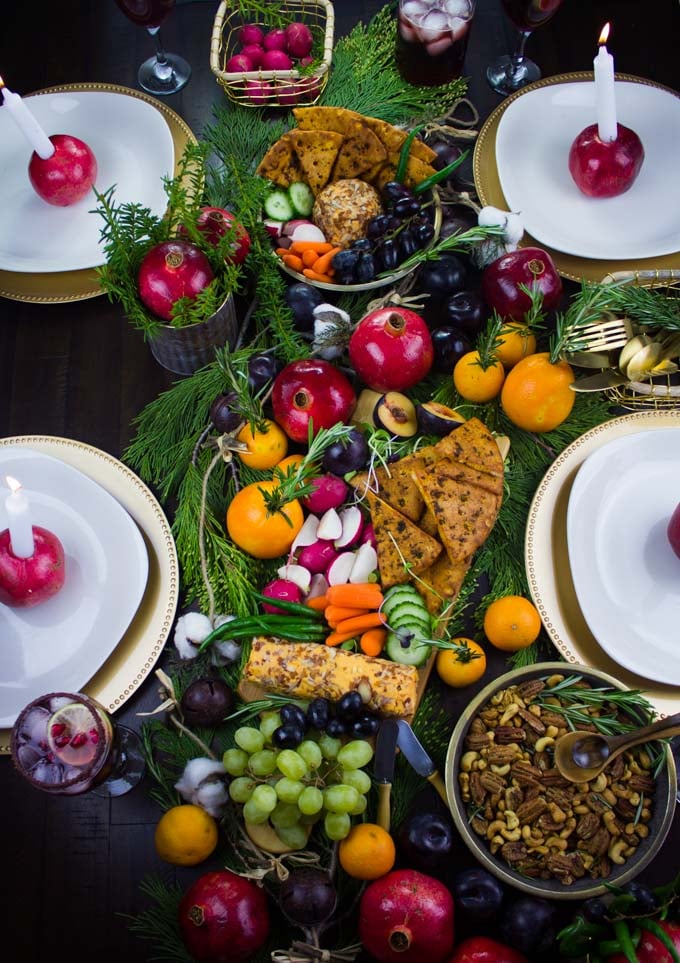 Rosemary Spiced Candied Pecans and Pita Chips arranged on a table with seasonal fruit for A Cheese Party